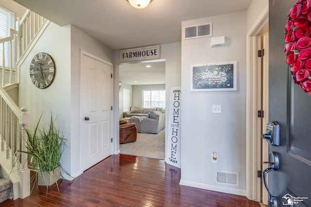 foyer entrance with dark hardwood / wood-style floors