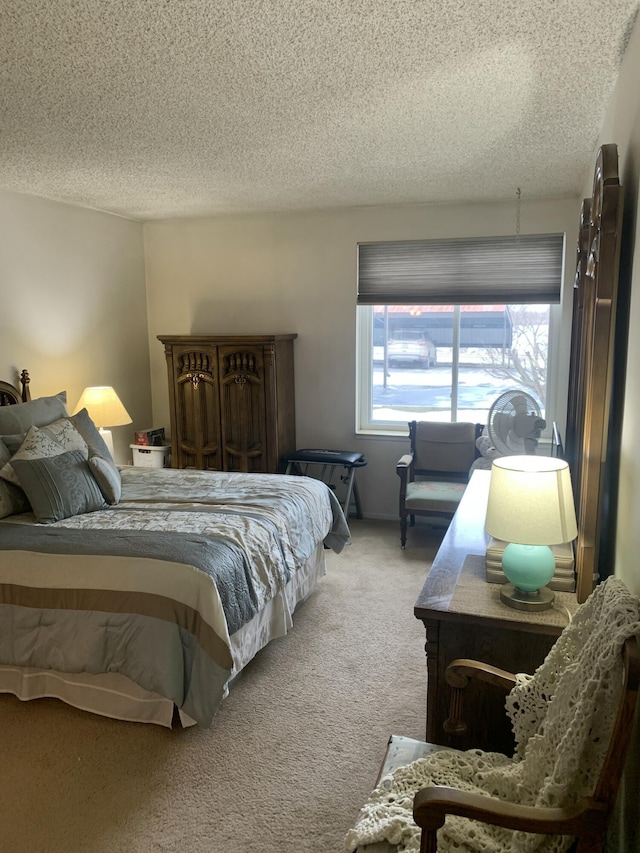 bedroom featuring a textured ceiling and carpet