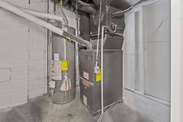 utility room featuring gas water heater and heating unit