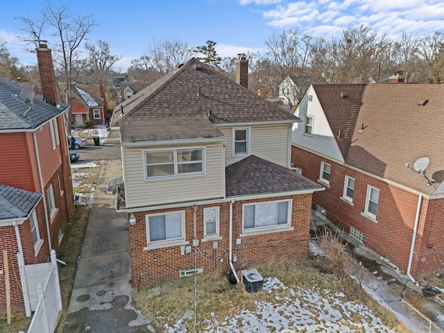 back of property with central air condition unit