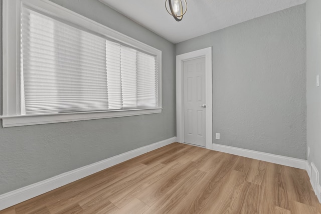 unfurnished room featuring light wood-type flooring