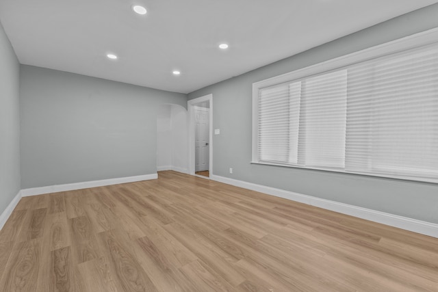 unfurnished room featuring light wood-type flooring