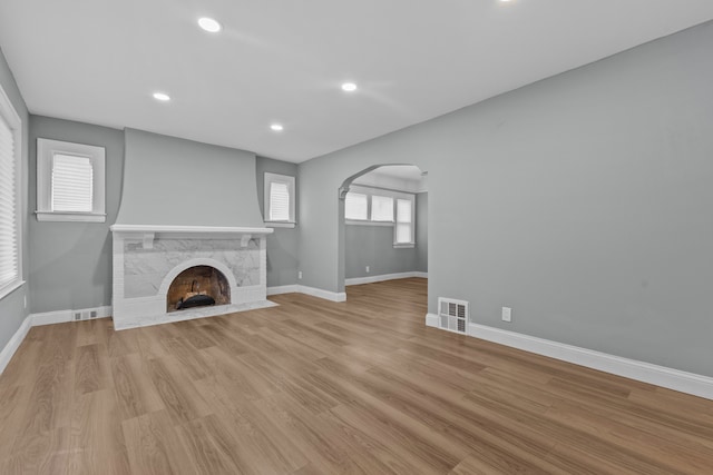 unfurnished living room with light wood-type flooring