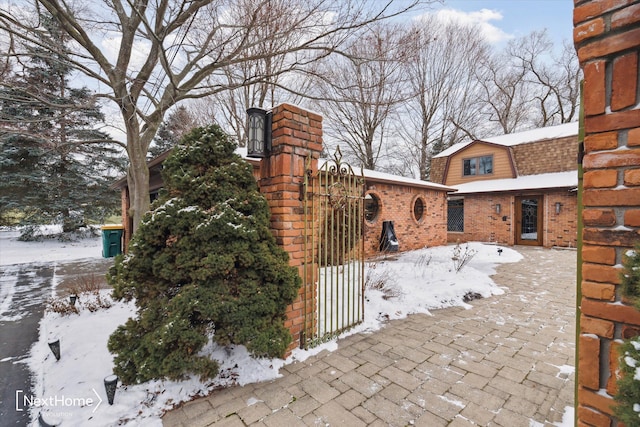 view of snow covered gate