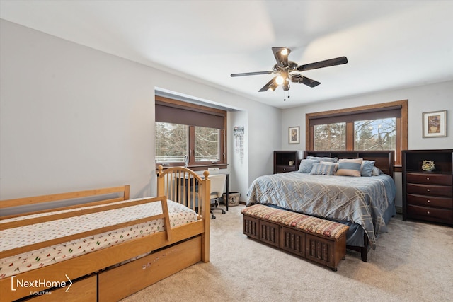 bedroom featuring ceiling fan and light colored carpet