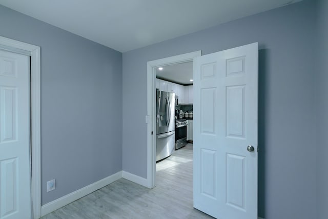 empty room with light wood-type flooring