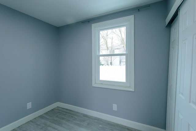 spare room with light wood-type flooring