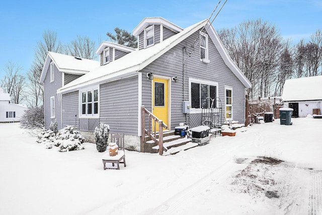 view of snow covered house