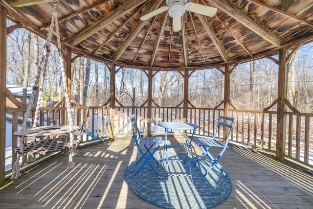 wooden deck with a gazebo and ceiling fan