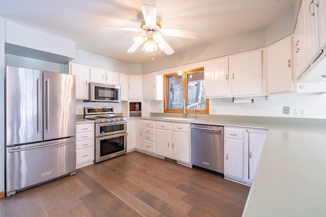 kitchen featuring white cabinetry, appliances with stainless steel finishes, dark wood-type flooring, and ceiling fan