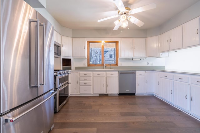 kitchen featuring high end appliances and white cabinets