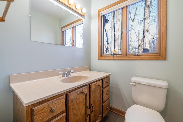 bathroom featuring vanity and toilet