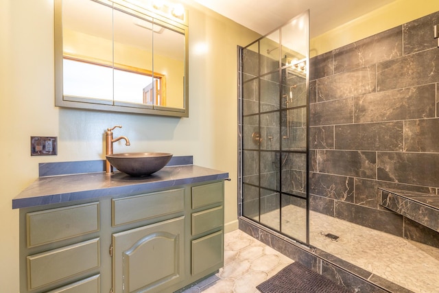 bathroom featuring vanity and a shower with shower door