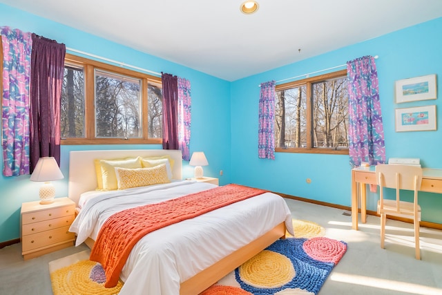 bedroom featuring light carpet