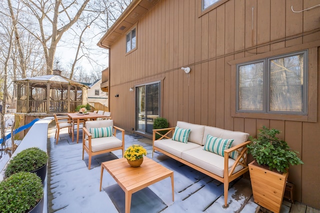 view of patio featuring an outdoor living space and a gazebo