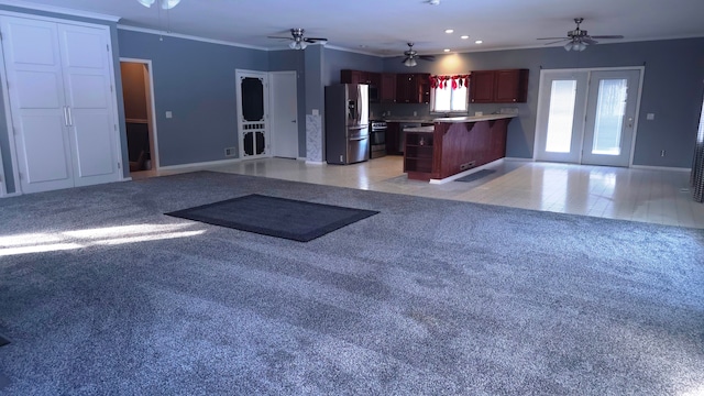 interior space with crown molding, light carpet, stainless steel fridge, and ceiling fan