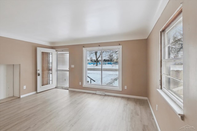 spare room featuring light wood-type flooring