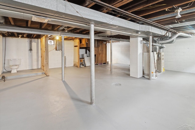 basement with water heater and electric panel