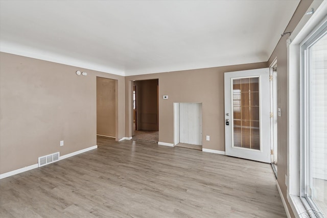 spare room featuring light hardwood / wood-style flooring