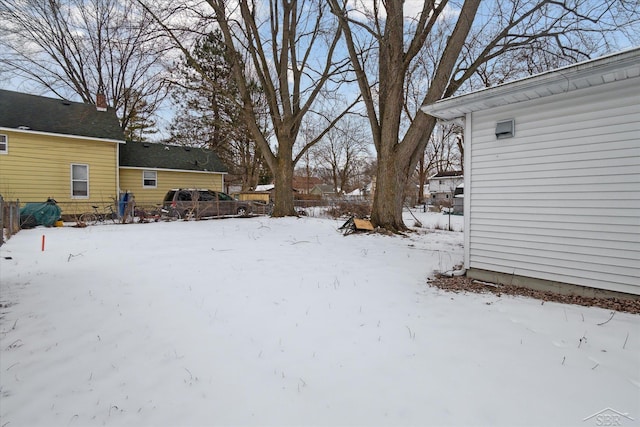 view of yard covered in snow