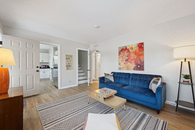 living room with light hardwood / wood-style flooring