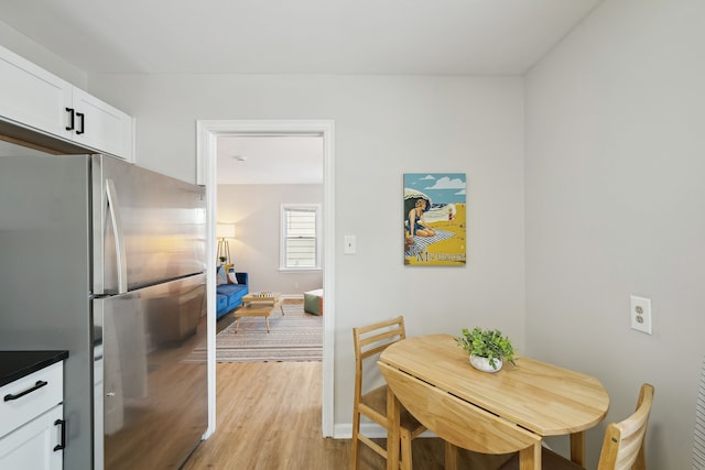 dining space featuring light hardwood / wood-style flooring