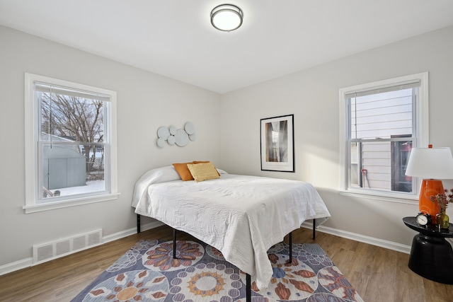 bedroom with hardwood / wood-style floors