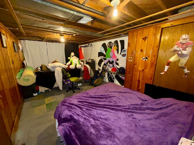 bedroom with wood walls