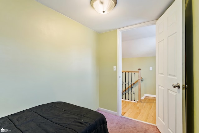 bedroom featuring light colored carpet