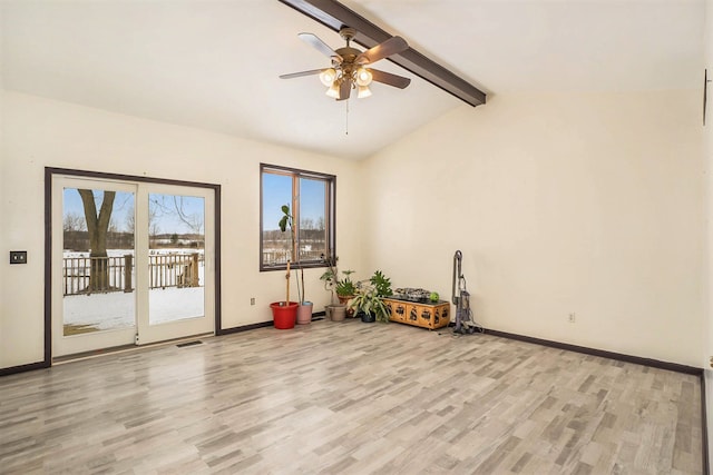 workout room featuring lofted ceiling, ceiling fan, and light wood-type flooring