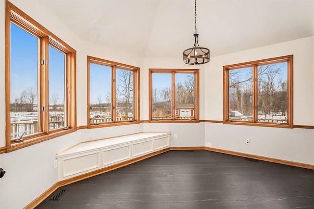 unfurnished sunroom with a chandelier