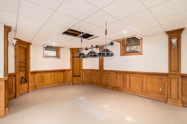 basement featuring a drop ceiling