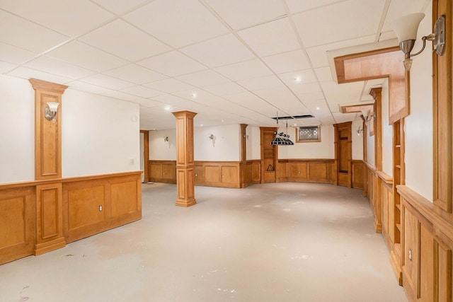 basement with a paneled ceiling