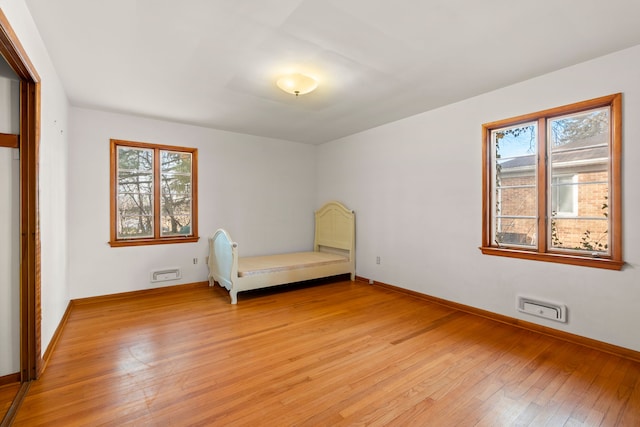 unfurnished bedroom with light hardwood / wood-style flooring