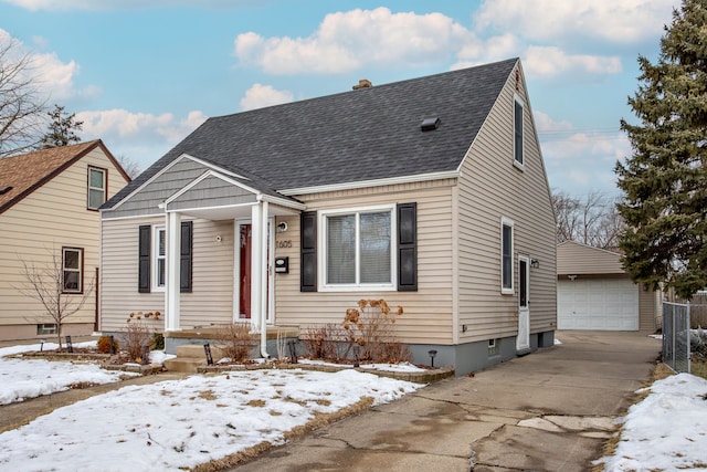 view of front of property with a garage and an outdoor structure