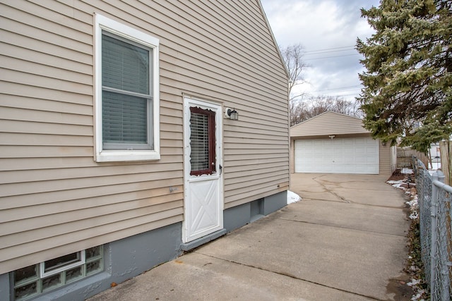 exterior space with a garage and an outdoor structure