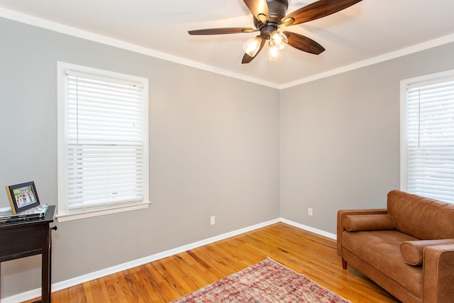 sitting room featuring crown molding, ceiling fan, and wood-type flooring