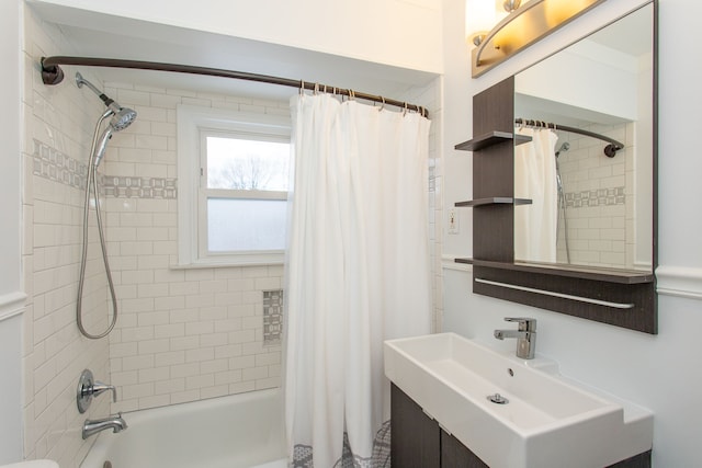 bathroom with shower / tub combo with curtain and sink