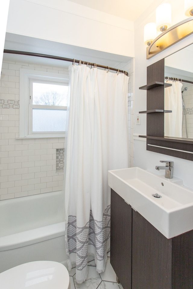 full bathroom with shower / tub combo with curtain, vanity, and toilet