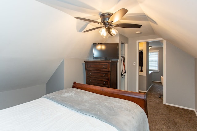 carpeted bedroom featuring vaulted ceiling and ceiling fan