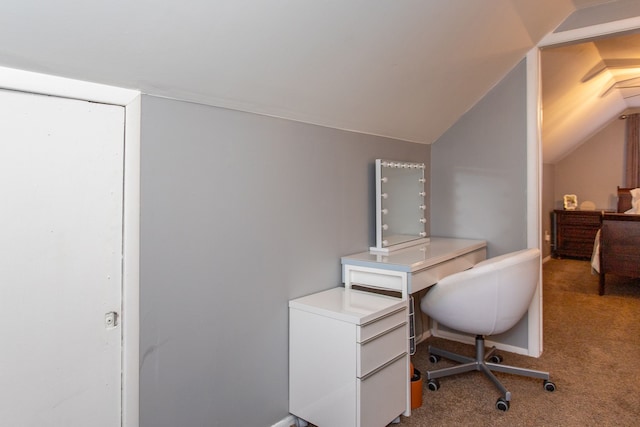 home office featuring light carpet and vaulted ceiling