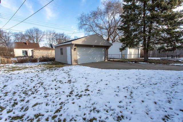 exterior space with a garage and an outdoor structure