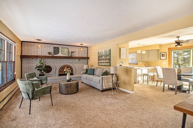 carpeted living room featuring a baseboard heating unit, a fireplace, and ceiling fan