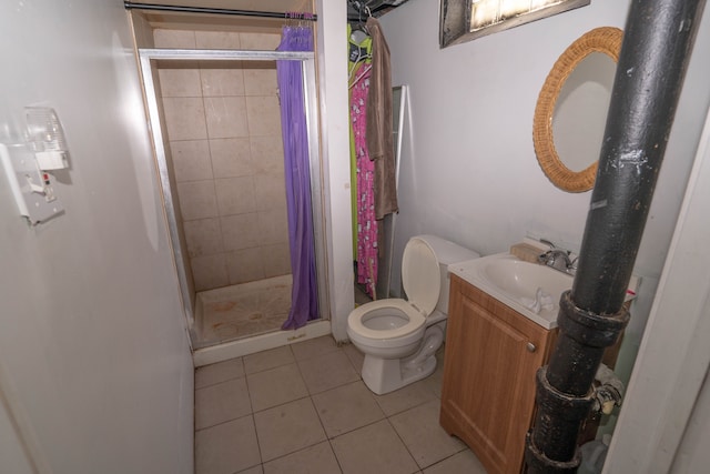 bathroom featuring vanity, curtained shower, tile patterned floors, and toilet