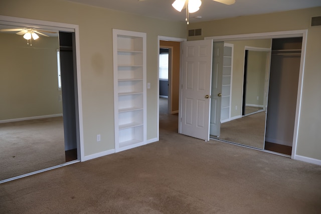 unfurnished bedroom featuring visible vents, baseboards, a ceiling fan, and carpet flooring