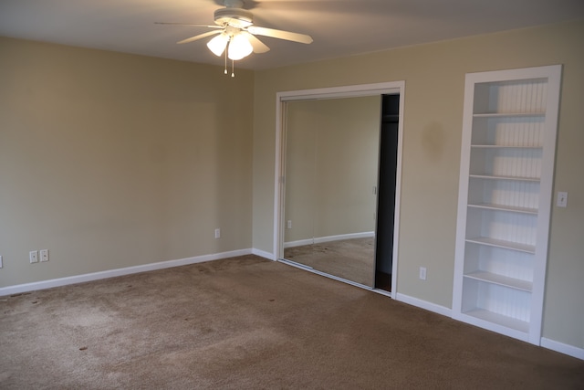 unfurnished bedroom with a closet, baseboards, ceiling fan, and carpet flooring