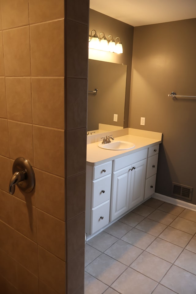 bathroom featuring tile patterned floors, vanity, and visible vents