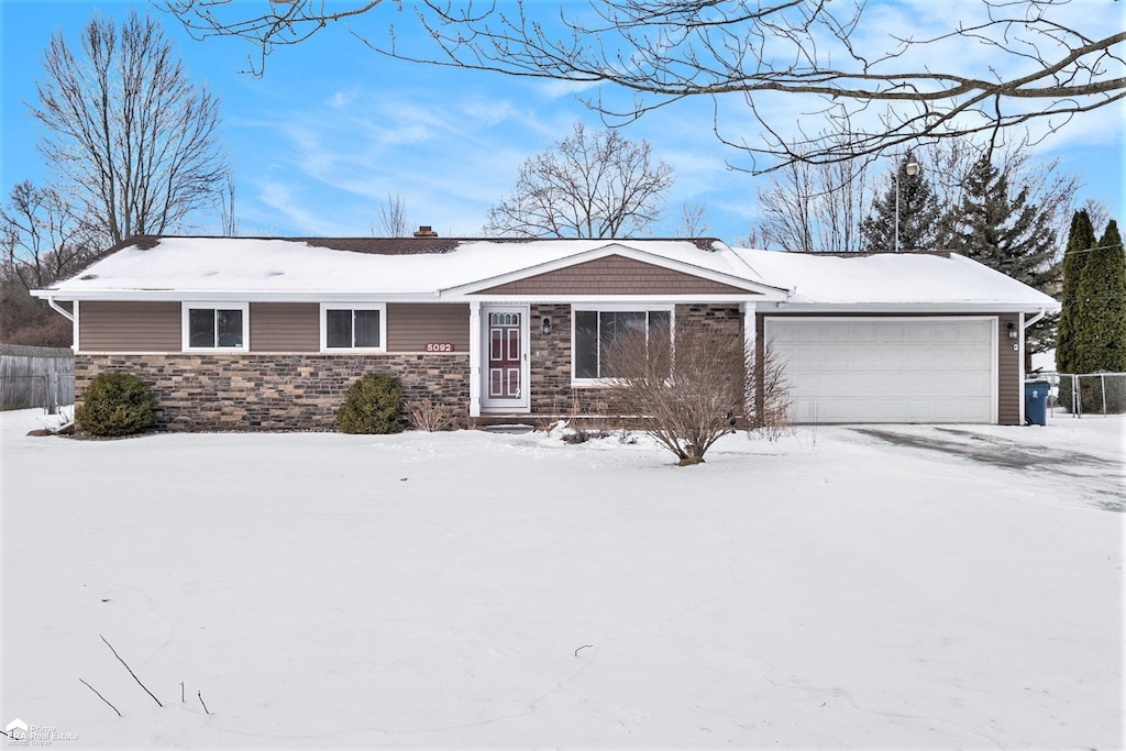 single story home with a garage