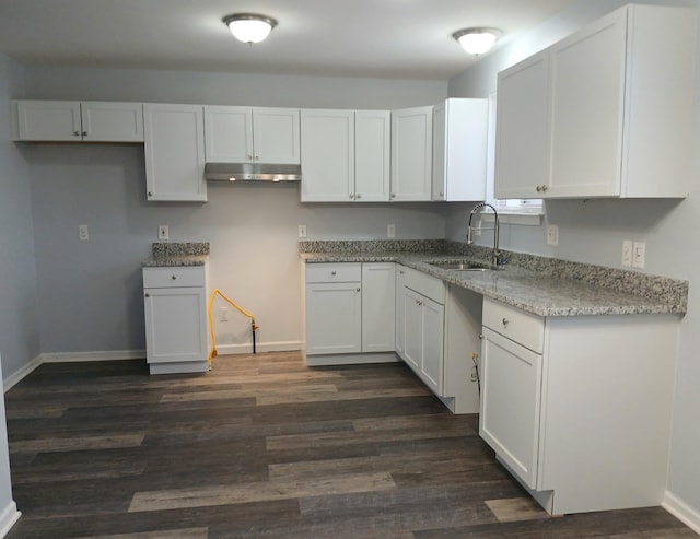 kitchen featuring sink, white cabinets, and dark hardwood / wood-style flooring