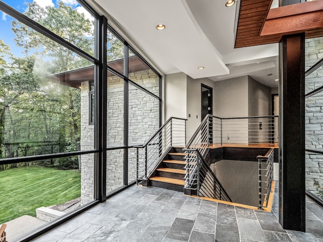 stairs with floor to ceiling windows